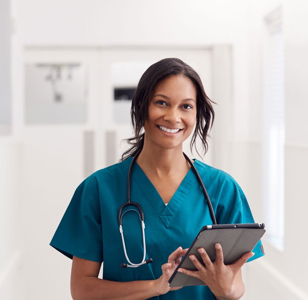 portrait-of-smiling-female-doctor-wearing-scrubs-KLLFEZS-1.jpg